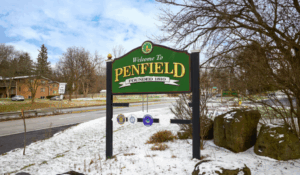 Welcome to Penfield New York founded 1810 sign Monroe County real estate