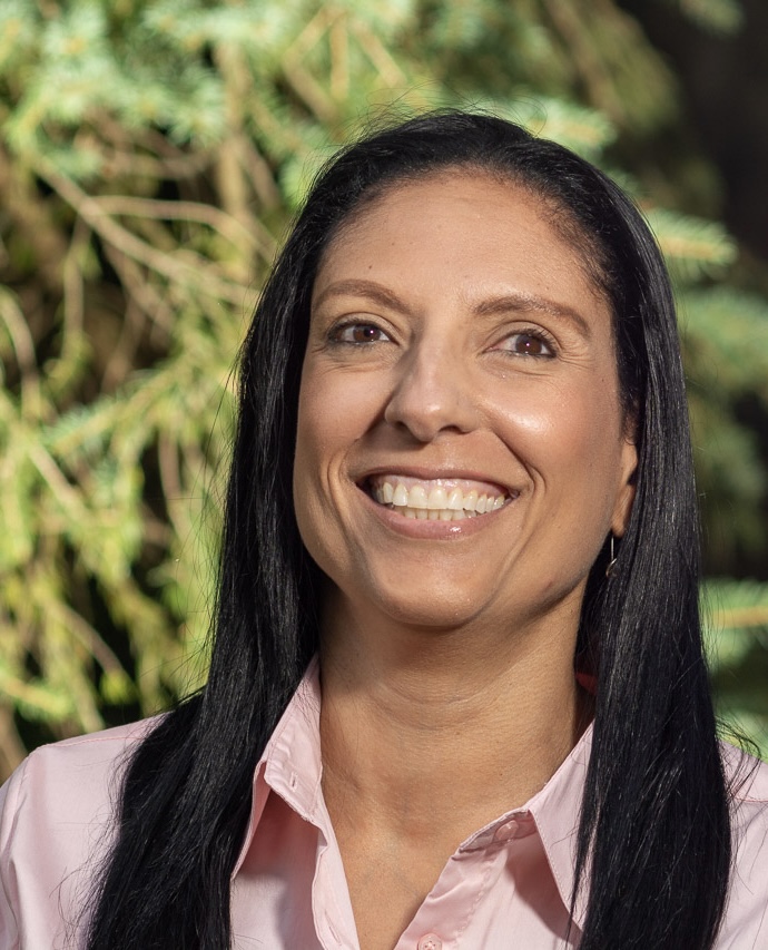 Person with long black hair outdoors